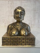 Bronze bust of an ancient Indian goddess with elaborate jewelry and traditional attire.